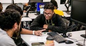 students studying together in computer lab